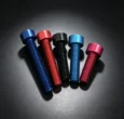 Anodized aluminum fasteners in multiple colors on a dark background