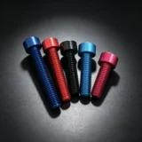 Anodized aluminum fasteners in multiple colors on a dark background