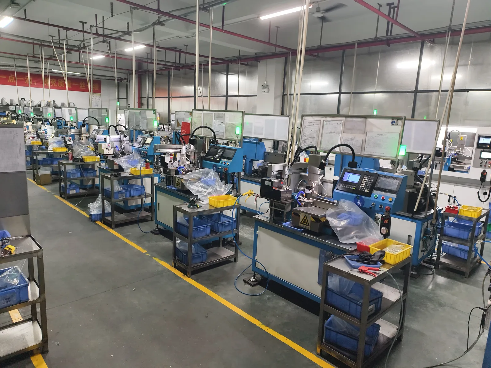 Rows of precision screw manufacturing equipment in the XiYu workshop