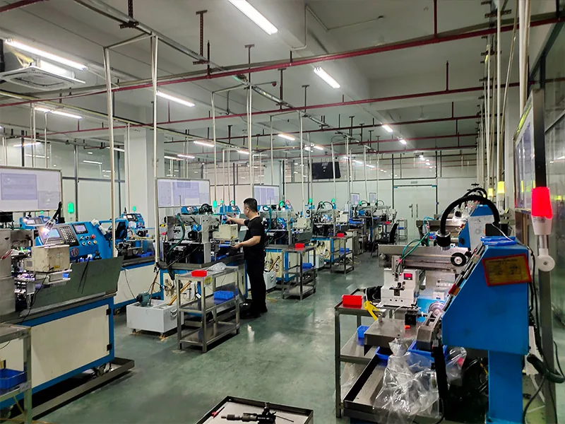 Operator working with precision screw production equipment at XiYu